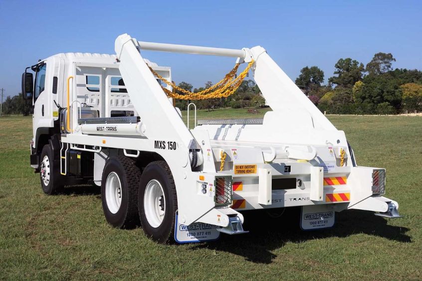 White skip loader truck